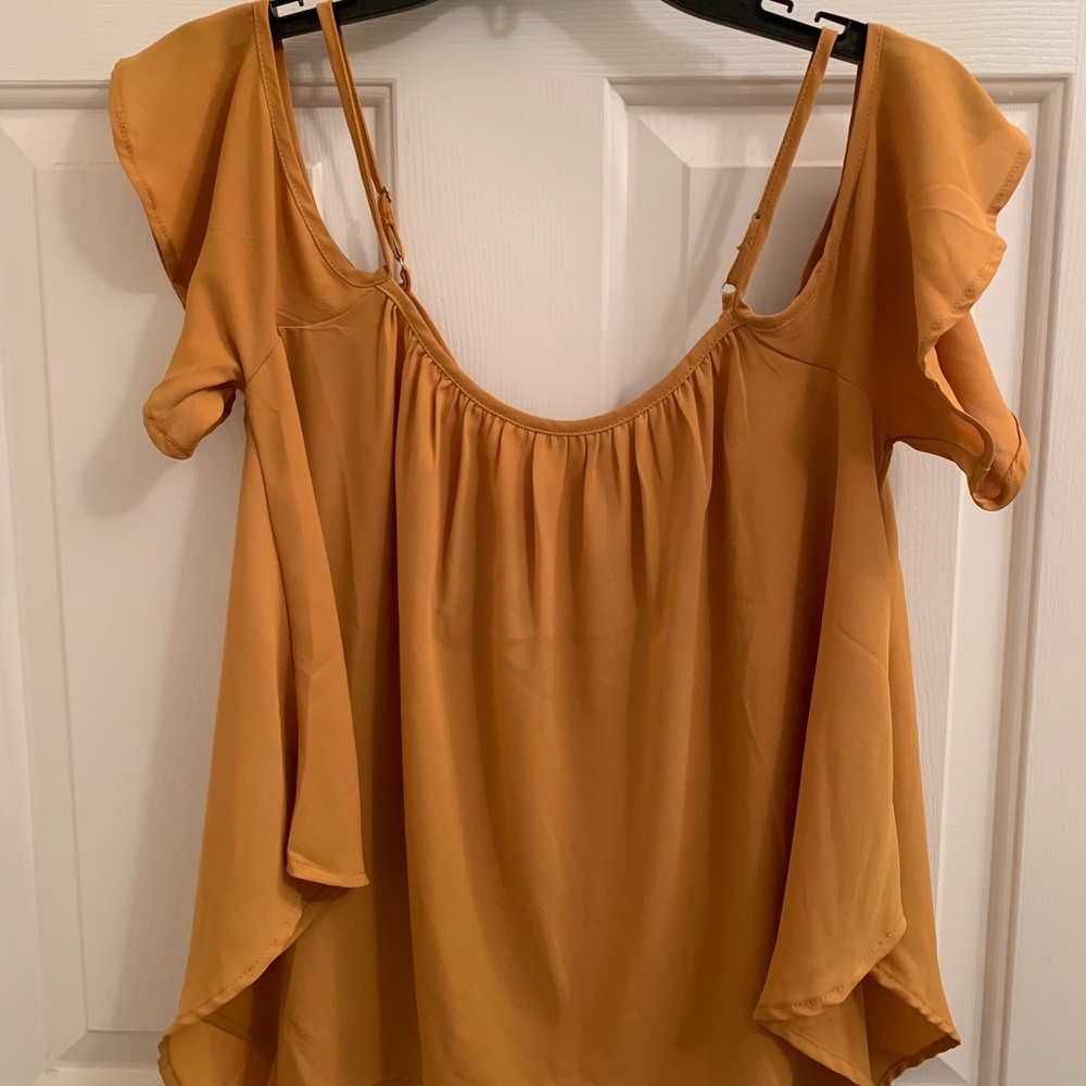 Mustard color, off the shoulders top.